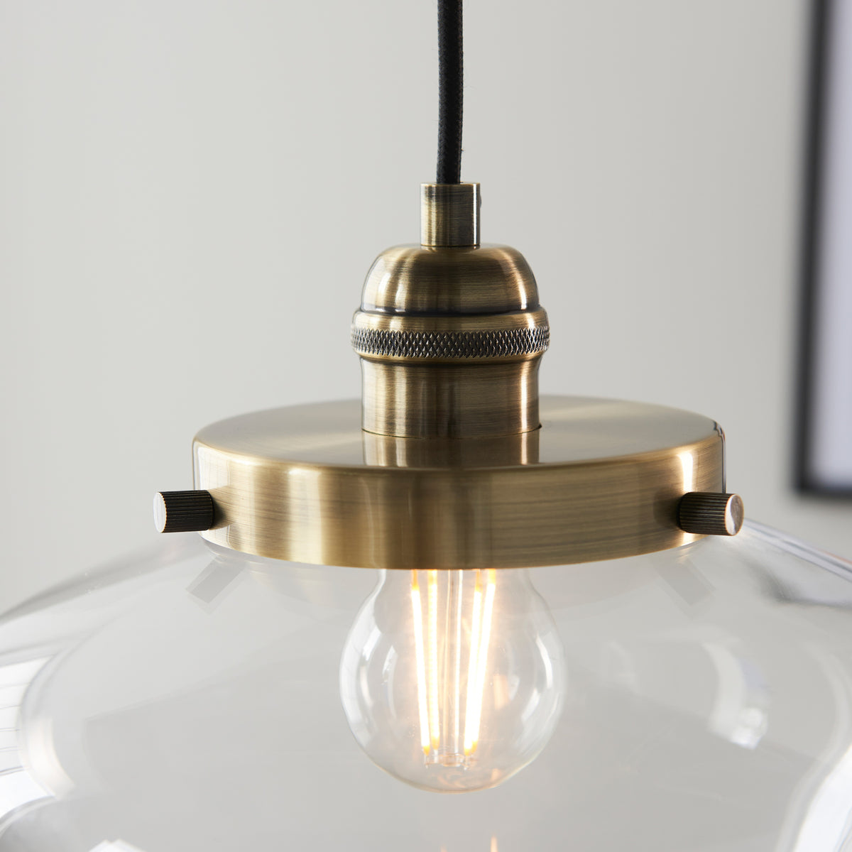 Gallery Direct Lindby Pendant Light Brass / Clear, styled in a room setting