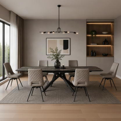 Florence Extending Oval Dining Table in Ceramic Volcano with a dark patterned top and black base, styled with upholstered dining chairs.