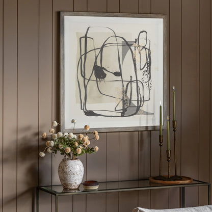 Gallery Direct Abstract Framed Art, styled above a console table against a warm brown panelled wall