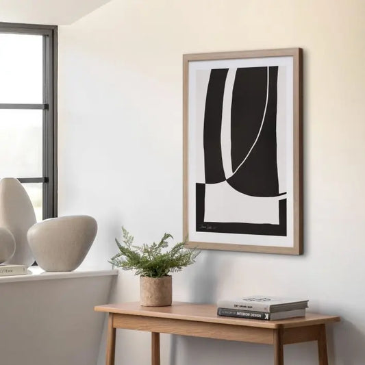 Gallery Direct Abstract Noir et Blanc Framed Artwork, is a black and white statement piece in an abstract geometric design