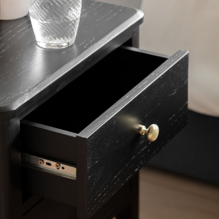 Gallery Direct Acton Bedside in Black features 2 drawers with gold coloured handles and a wood grain effect