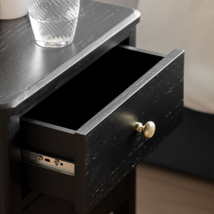 Gallery Direct Acton Bedside in Black features 2 drawers with gold coloured handles and a wood grain effect