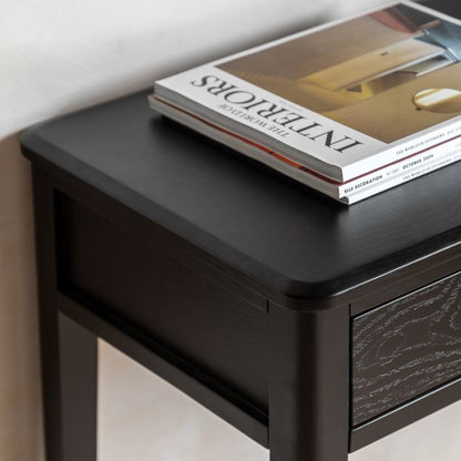 Gallery Direct Acton Black Console Table features 2 top drawers with wood grain effect, gold coloured handles and slim tapered legs