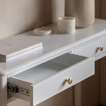 Gallery Direct Acton 2 Drawer Console Table in White with gold coloured round handles and a subtle wood grain effect