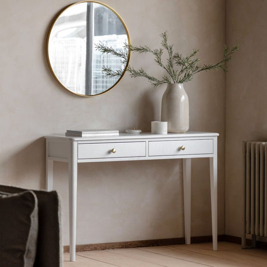 Gallery Direct Acton White Console Table features 2 top drawers with gold coloured handles and slim tapered legs