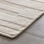 Gallery Direct Albany Hand Tufted Cream Tonal Rug with an abstract pattern measures 1600x2300mm