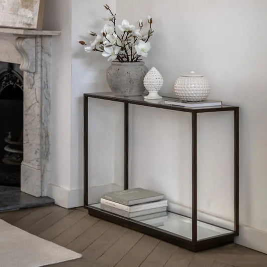 Gallery Direct Avento Console Table has a contemporary design with striking bronze metal framework, a pristine glass table top and a mirrored lower shelf