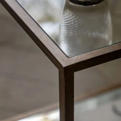 Gallery Direct Avento Side Table with a bronze colour metal frame and glass table top