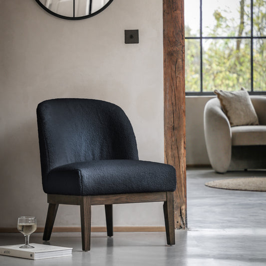 Gallery Direct Bardfield Accent Chair in a deep Blue boucle style fabric, with soft padded seat and backrest and dark oak wood frame and legs