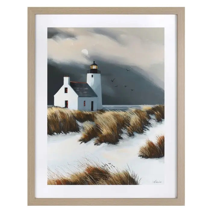 Gallery Direct Beyond the Dunes Framed Art by artist Sabrina Rosco features a serene coastal landscape with lighthouse and dunes with an oak effect frame