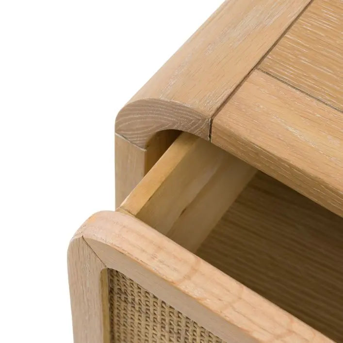 Gallery Direct Bibury 3 Drawer Chest features a gently curved design, constructed from a lime washed oak and pine wood frame, with rattan detail to the drawer fronts