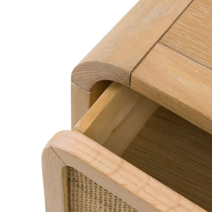 Gallery Direct Bibury 3 Drawer Chest features a gently curved design, constructed from a lime washed oak and pine wood frame, with rattan detail to the drawer fronts