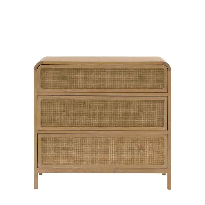 The Gallery Direct Bibury 3 Drawer Chest is constructed from oak and pine wood veneers with a soft lime wash finish, rattan detailing to the drawer fronts with bronzed metal handles
