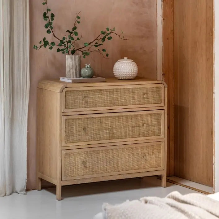 Gallery Direct Bibury 3 Drawer Chest features rattan detailing to the drawer fronts, bronzed metal handles and curved edges to the frame