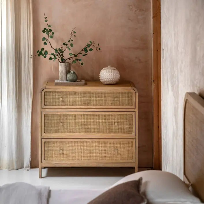 Gallery Direct Bibury 3 Drawer Chest crafted from oak and pine wood and veneers, with a soft lime wash finish, rattan detailing, gently curved edges and bronzed metal drawer knobs
