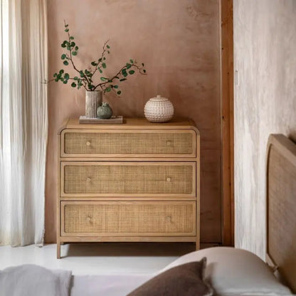 Gallery Direct Bibury 3 Drawer Chest crafted from oak and pine wood and veneers, with a soft lime wash finish, rattan detailing, gently curved edges and bronzed metal drawer knobs