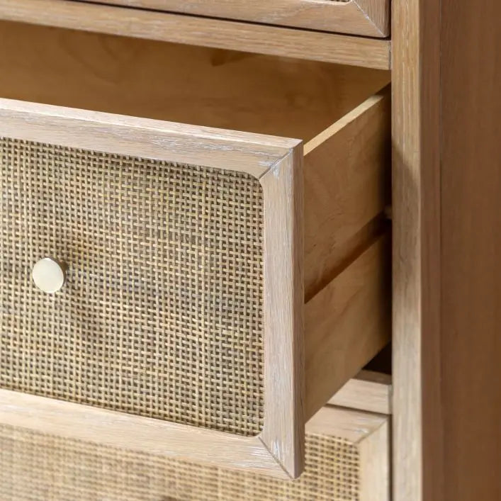 Gallery Direct Bibury 3 Drawer Chest features a soft lime washed finish, with rattan detailed drawer fronts and bronzed metal handles