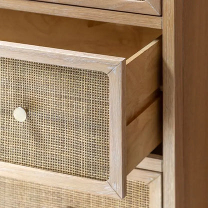 Gallery Direct Bibury 3 Drawer Chest features a soft lime washed finish, with rattan detailed drawer fronts and bronzed metal handles
