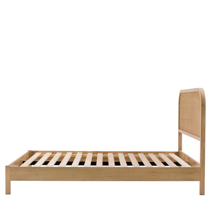 Gallery Direct Bibury Double Bed made with oak and pine wood and veneers in a soft lime wash finish, with wooden slats and a rattan design headboard