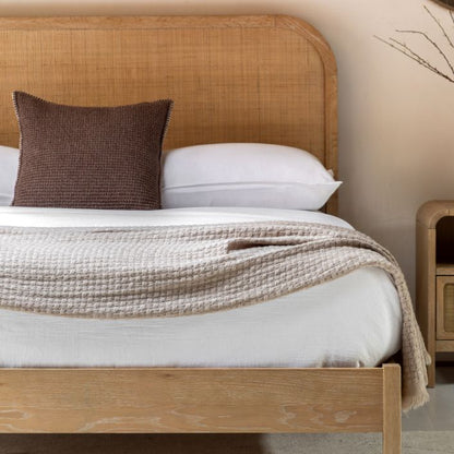 Gallery Direct Bibury King Size Bed with a curved rattan headboard and soft lime wash finished frame