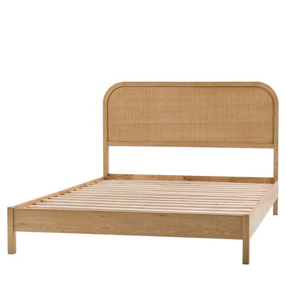 Gallery Direct Bibury King Size Bed features a rattan detail headboard with curved edges, a lime wash finished frame and wooden slats