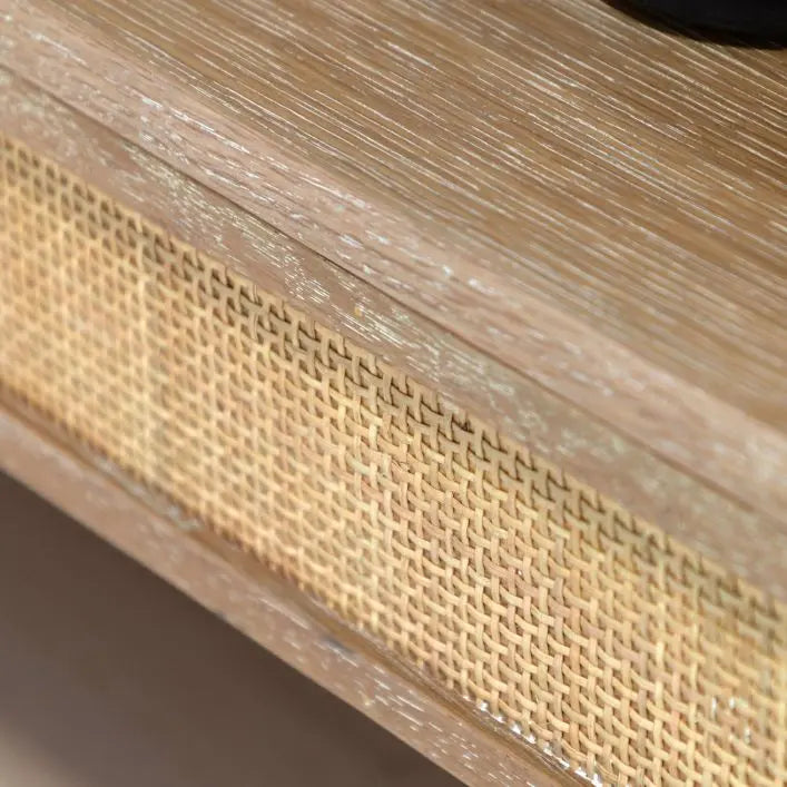 Gallery Direct Bibury Open Wardrobe is crafted from oak and pine wood and veneers in a soft lime washed finish with rattan detailing surrounding the lower shelf