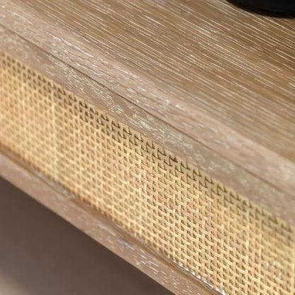 Gallery Direct Bibury Open Wardrobe is crafted from oak and pine wood and veneers in a soft lime washed finish with rattan detailing surrounding the lower shelf