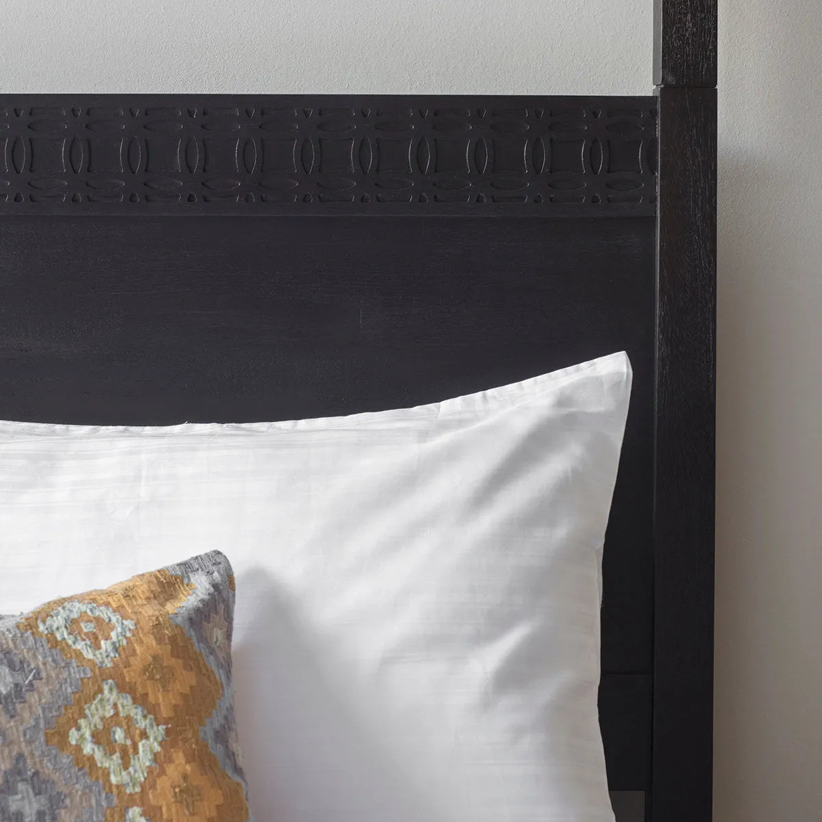 Gallery Direct Boho Boutique 4 Poster 6ft Super King Bed in a matt black charcoal finish with an ethnic inspired inlaid pattern on the headboard