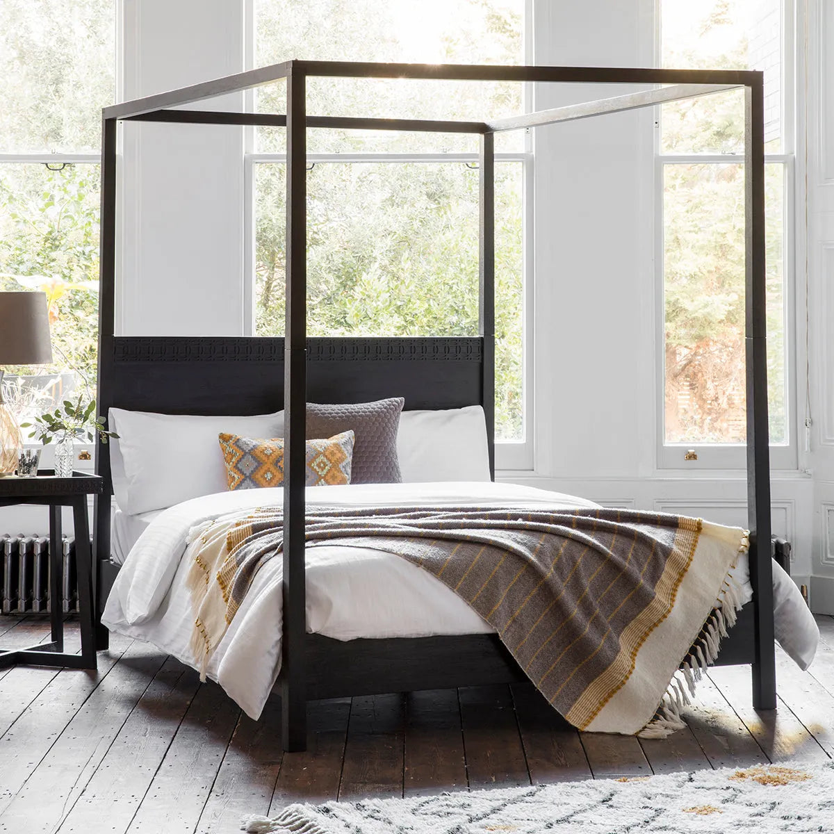 Gallery Direct Boho Boutique 4 Poster 6ft Super King Bed features an ethnic inspired inlaid pattern across the headboard, with a stunning matt black charcoal finish 