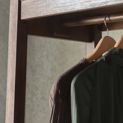 Close-up of the Boho Retreat wardrobe timber rail and hanging space