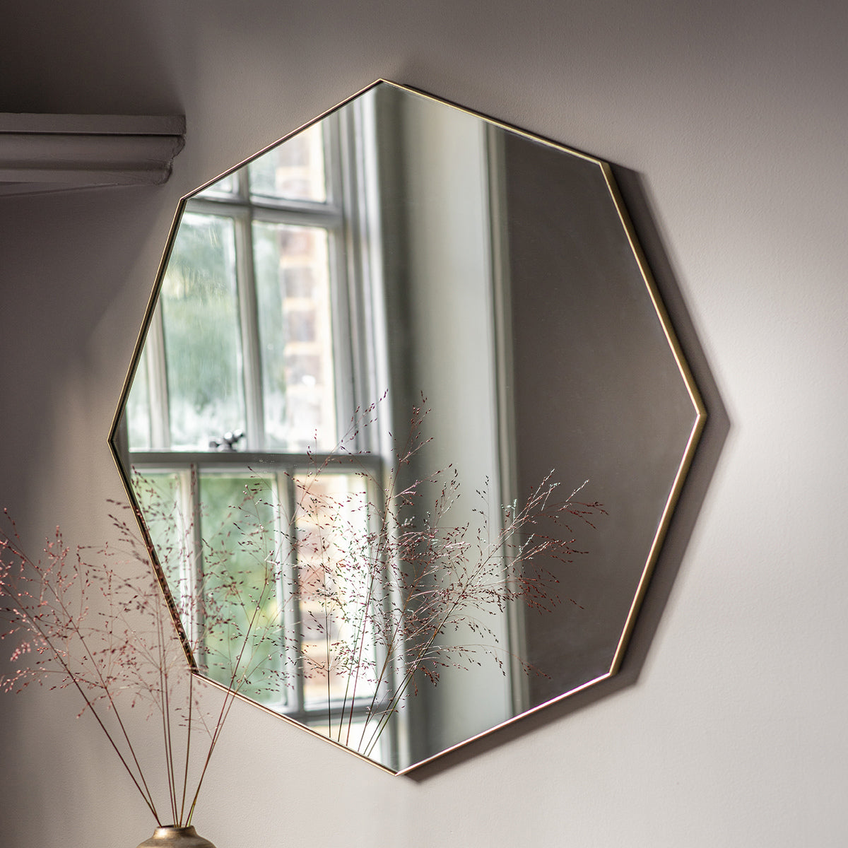 Gallery Direct Bowie Octagon Mirror Champagne displayed in a styled interior