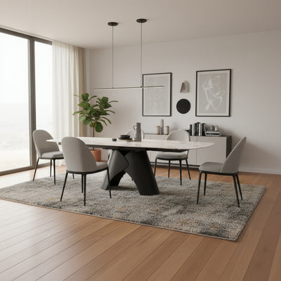 The Gallery Direct Bresso Extending Dining Table features a Carrara marble style rotating table top, and a matt black metal base