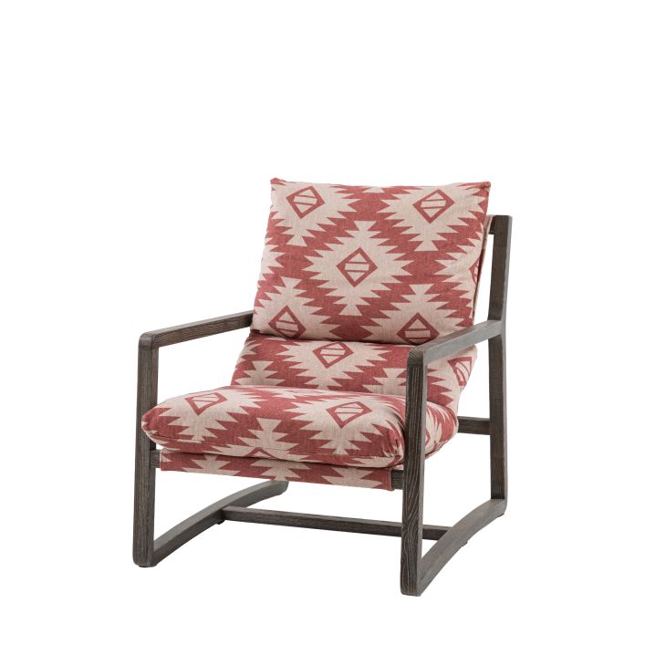 Gallery Direct Burela Lounge Chair upholstered in Mira Aztec red and natural coloured fabric, with a solid dark wooden frame