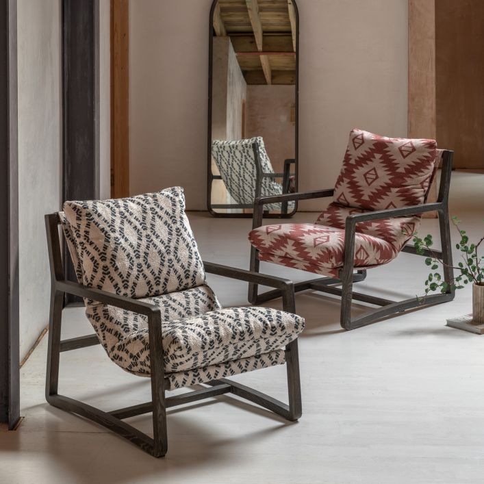 Gallery Direct Burela Lounge Chair in a red/natural colour Mira Aztec patterned upholstery and a dark wooden frame