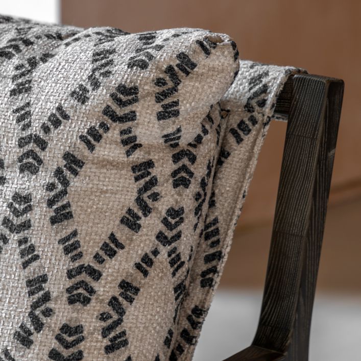 Gallery Direct Burela Lounge Chair upholstered in Obi Diamond pattern, navy and natural two tone fabric, with a dark wooden frame