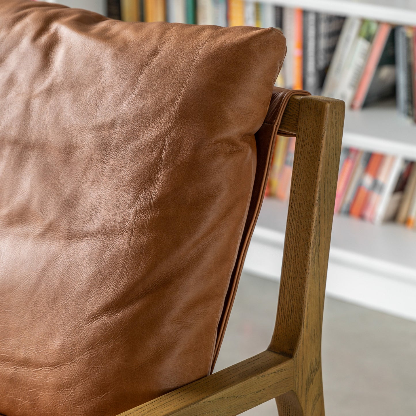 Gallery Direct Burela Lounge Chair in Vintage Brown Leather with padded seat and backrest for additional comfort, and a solid ash wood contemporary frame