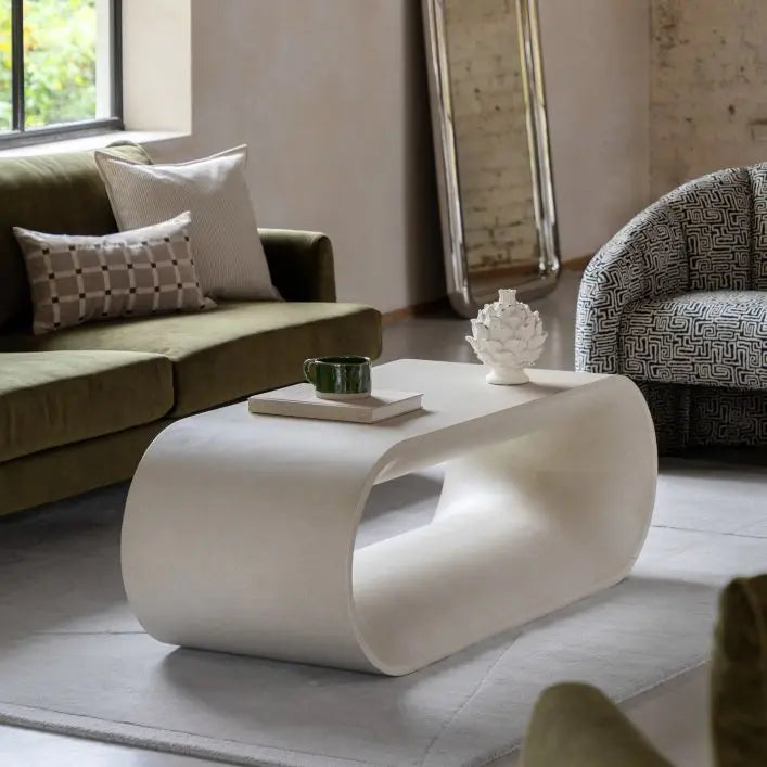 The Gallery Direct Caluso Coffee Table has a sculptural form that features smooth, rounded curves and a tactile surface in a sophisticated matt linen tone
