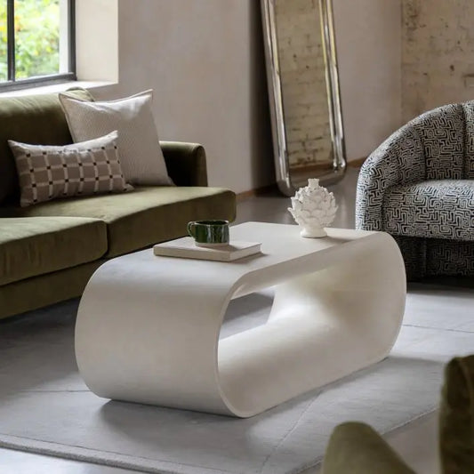The Gallery Direct Caluso Coffee Table has a sculptural form that features smooth, rounded curves and a tactile surface in a sophisticated matt linen tone