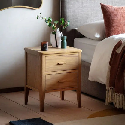 Gallery Direct Camden Bedside cabinet with 2 Drawers in a Natural warm wood-grain finish with slim legs and matching handles 