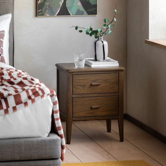 Gallery Direct Camden 2 Drawer Bedside Cabinet in a dark Walnut wood-grain finish with matching handles and slim tapered legs