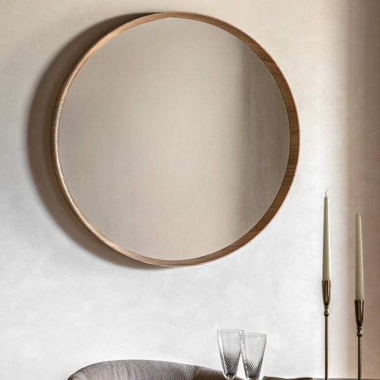 Gallery Direct Cedar Round Mirror Oak displayed in a styled interior