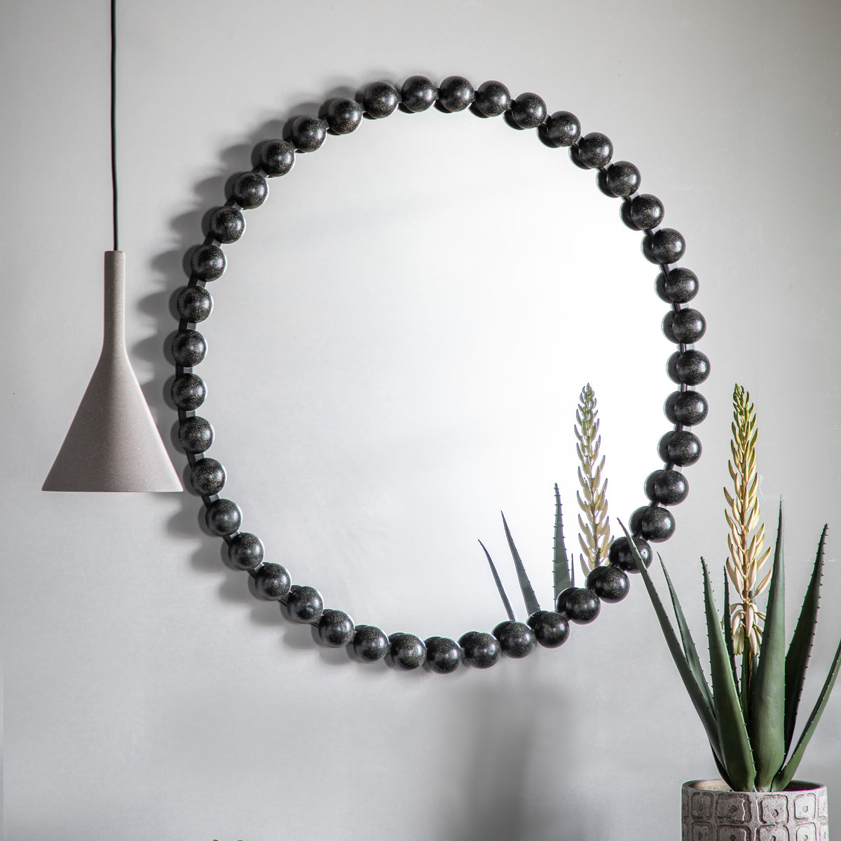 Gallery Direct Ceretti Round Mirror Black displayed in a styled interior