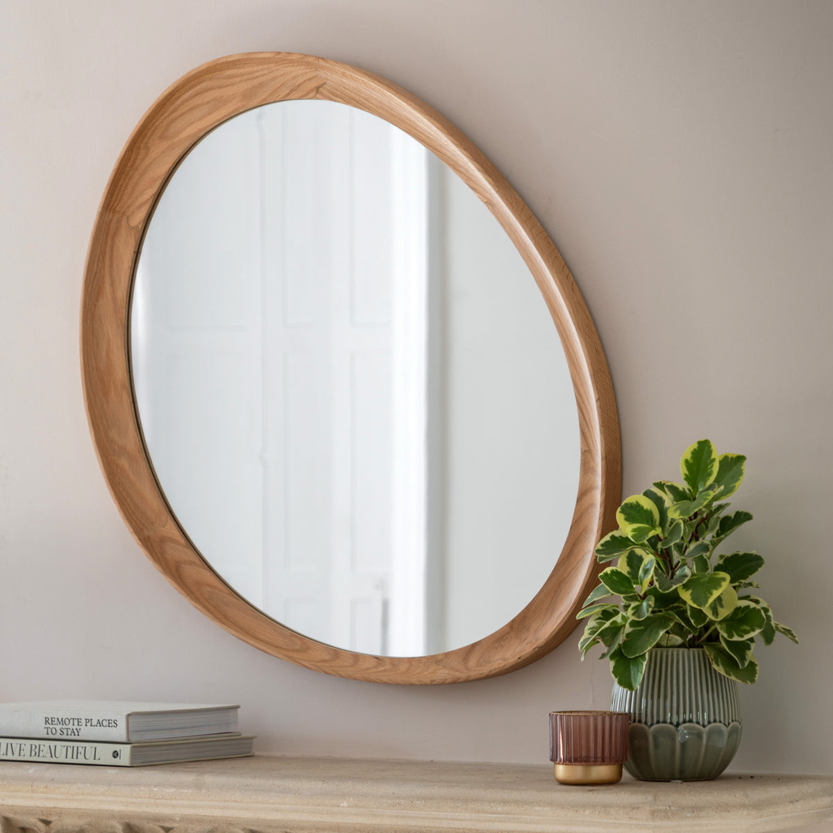 Gallery Direct Copenhagen Pebble Mirror Oak displayed in a styled interior