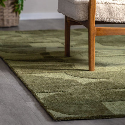The Cortland Olive Green Block Rug from Gallery Direct measures 1200x1800mm and features a striking geometric pattern