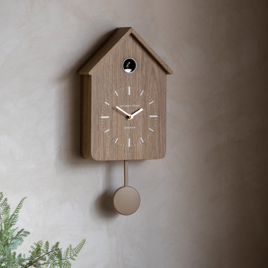 Gallery Direct Cuckoo Clock Oak displayed in a styled interior