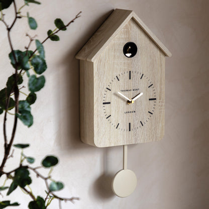 Gallery Direct Cuckoo Clock Washed Oak displayed in a styled interior