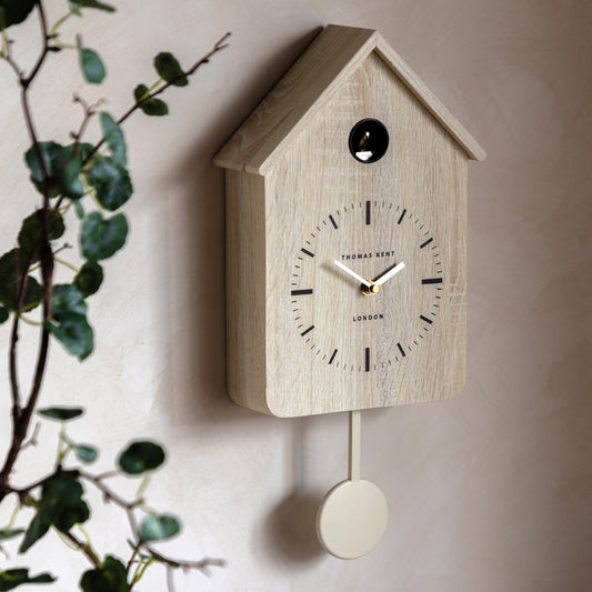 Gallery Direct Cuckoo Clock Washed Oak displayed in a styled interior