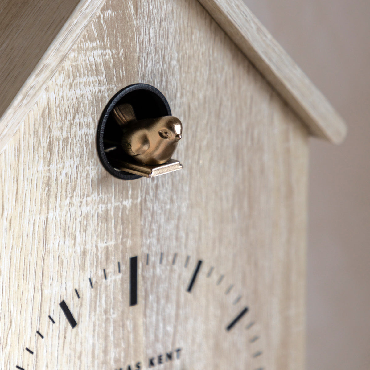 Gallery Direct Cuckoo Clock Washed Oak, close-up of the clock face and finish