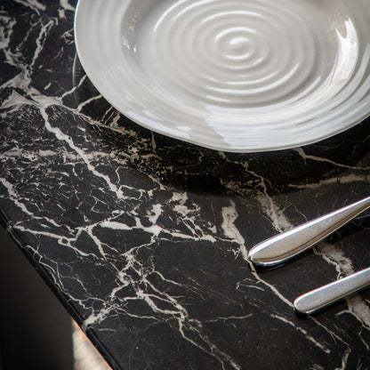Close-up of the Davidson table black marble effect glass top