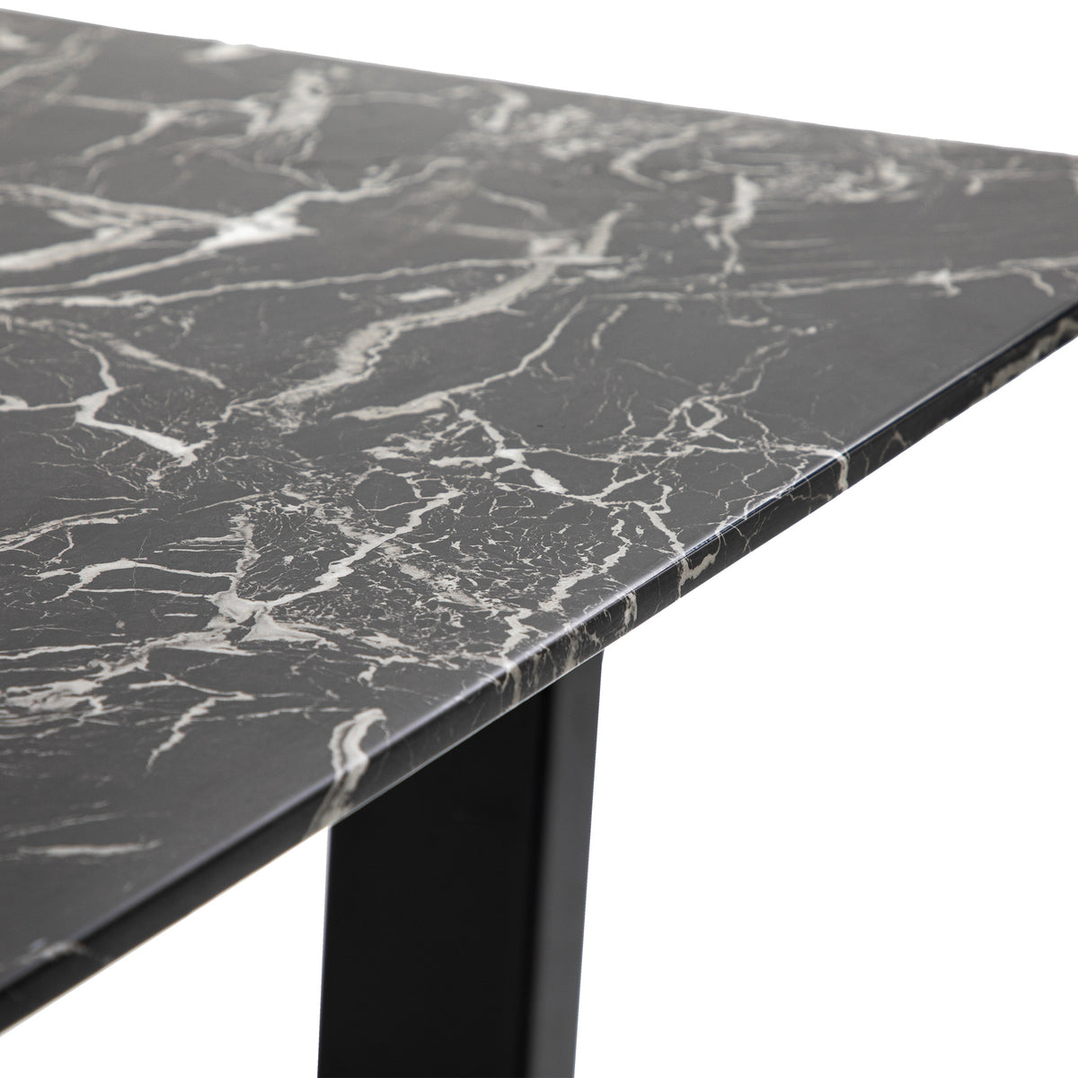 Detail of the Davidson dining table black marble effect tabletop edge